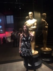 Skyler Madison at before an Oscar statue